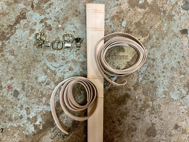 Close up of top half of scabbard with associated belts and metalwork